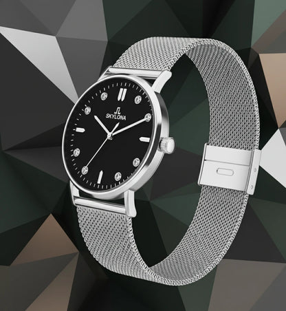 Close up of black dial on silver watch