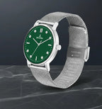 Close up of green dial on silver watch